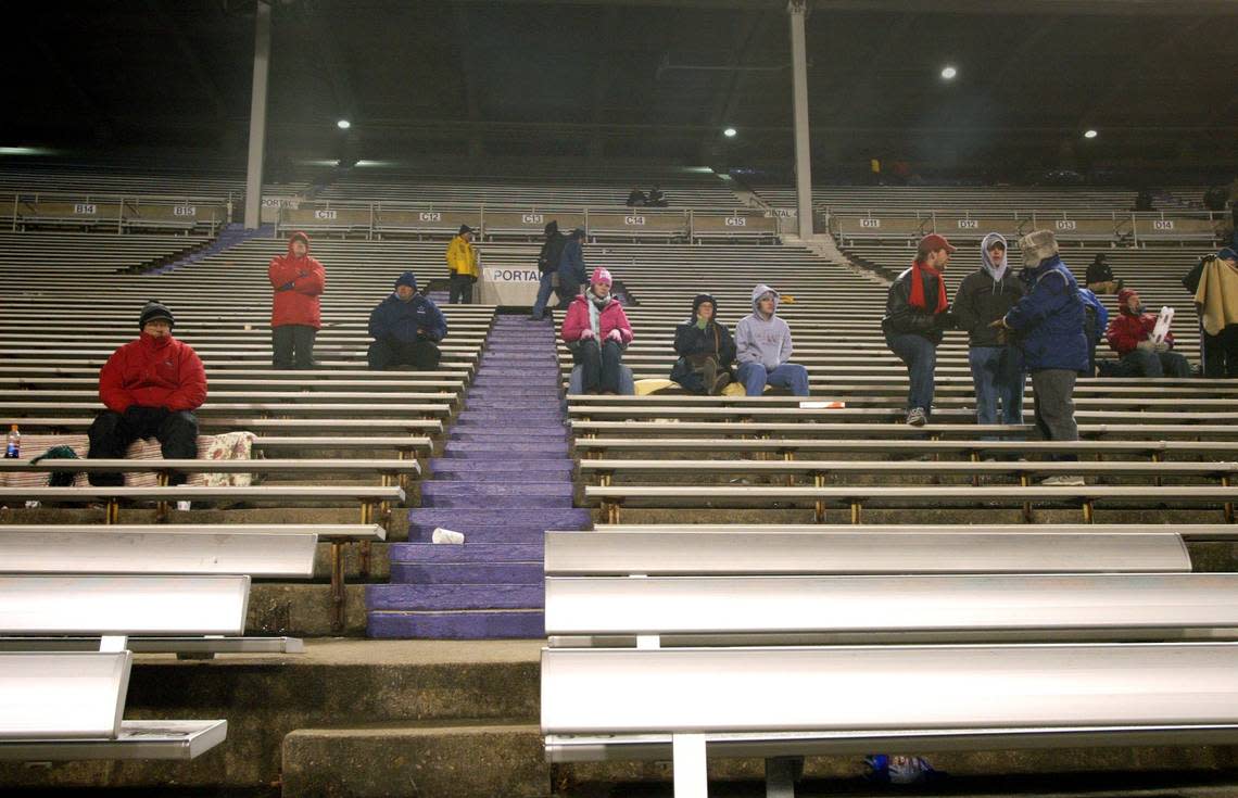 Just a few fans remain in the stands on the west side of Amon G. Carter Stadium during the fourth quarter of the 2004 Fort Worth Bowl when the wind chill dropped into the teens.