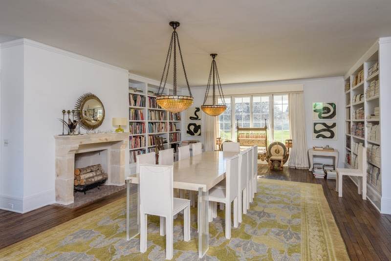 <p>The large dining room, with its wood fireplace, is cozy, yet elegant. <br>(Christie’s International Real Estate) </p>