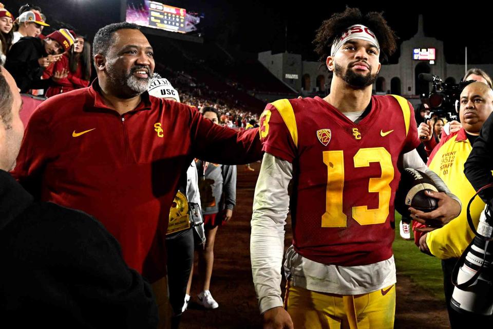 <p>Keith Birmingham/MediaNews Group/Pasadena Star-News/Getty</p> Caleb Williams and his dad Carl Williams celebrate USC Trojans defeating the Notre Dame Fighting Irish during a NCAA football game on November 26, 2022.