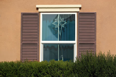 A decoration hangs in the window of the home of David Allen and Louise Anna Turpin in Perris, California, U.S., January 16, 2018. REUTERS/Mike Blake