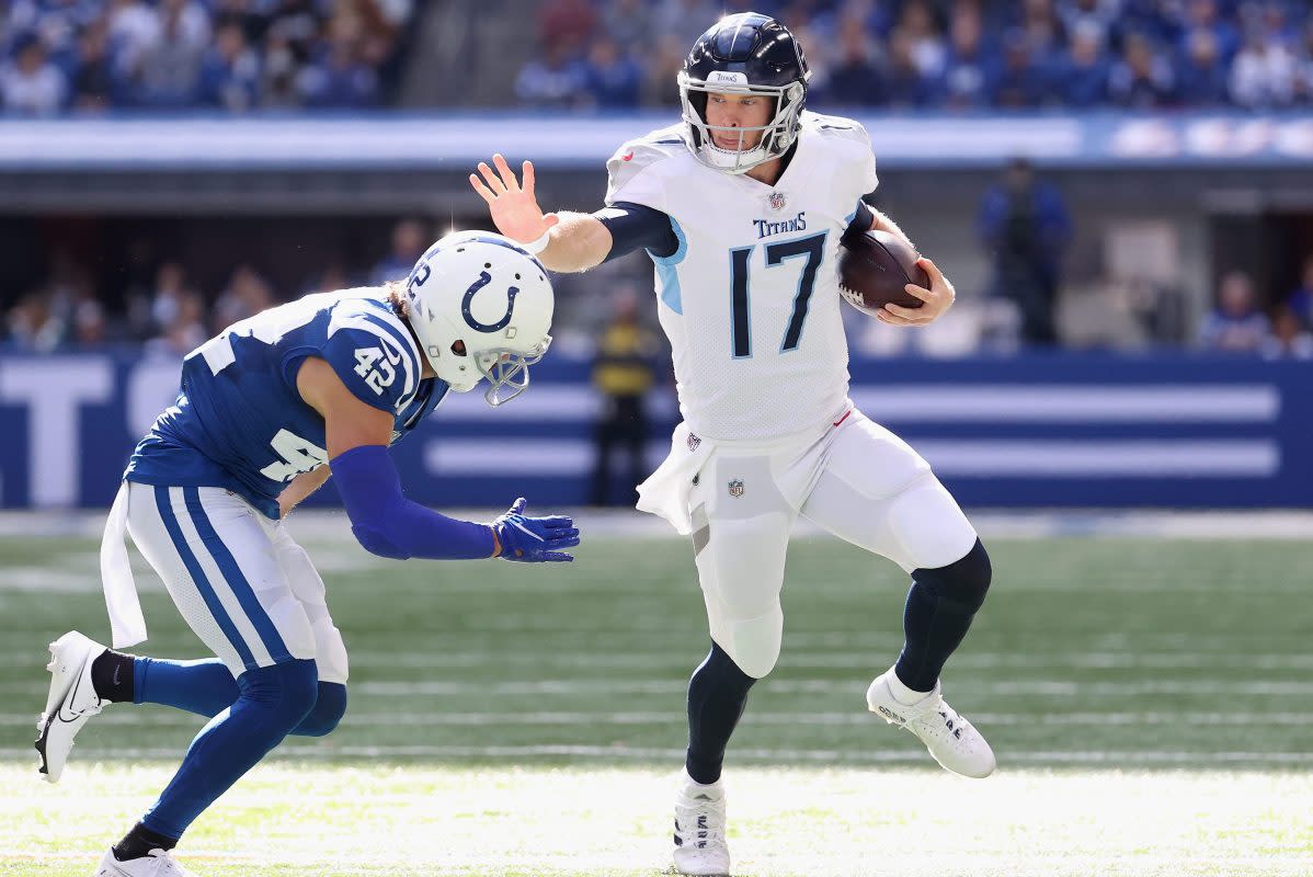 Ryan Tannehill stiff-arms Andrew Sendejo of the Indianapolis Colts