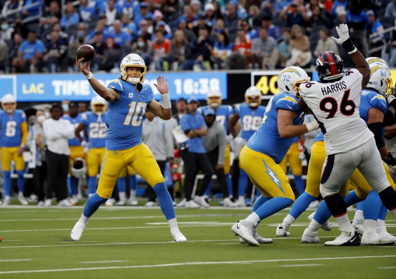 EL SEGUNDO, CA - JANUARY 2, 2022: Los Angeles Chargers quarterback Justin Herbert (10) throws a touchdown pass.