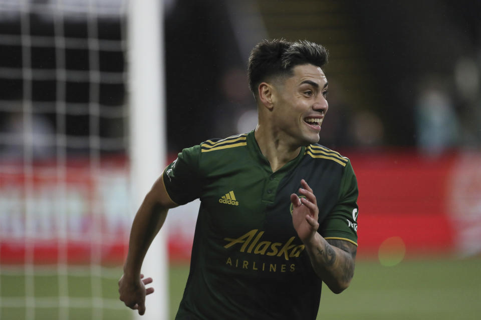 Portland Timbers forward Felipe Mora celebrates after scoring a goal against Real Salt Lake during the first half of the MLS soccer Western Conference final Saturday, Dec. 4, 2021, in Portland, Ore. (AP Photo/Amanda Loman)