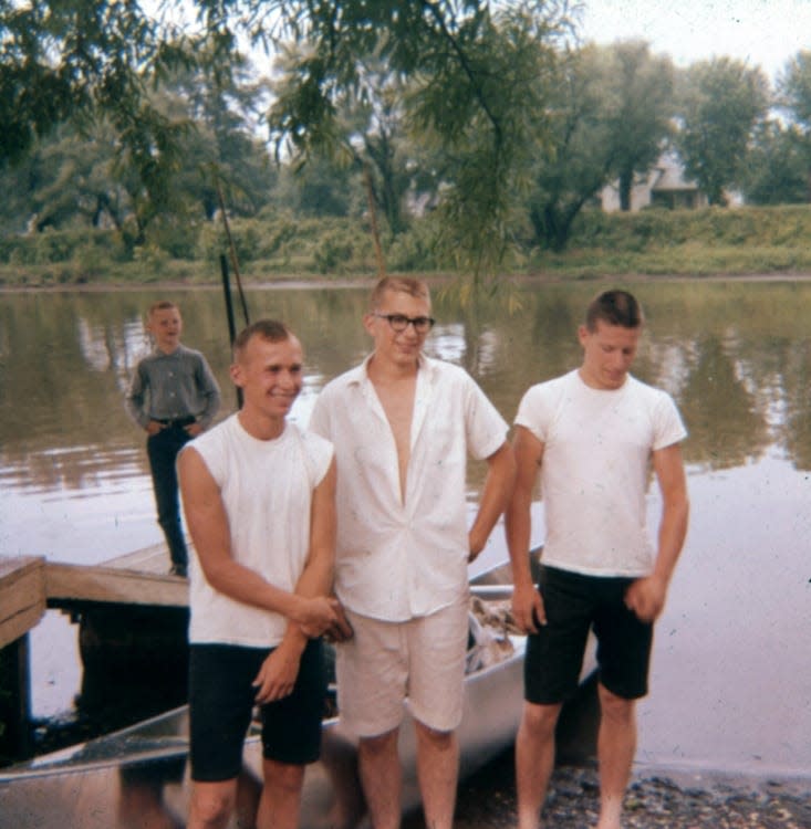 Jim Ecenbarger, left, Bill Malcuit and Terry Spidell pose for a picture before embarking for New Orleans from Dover by canoe.