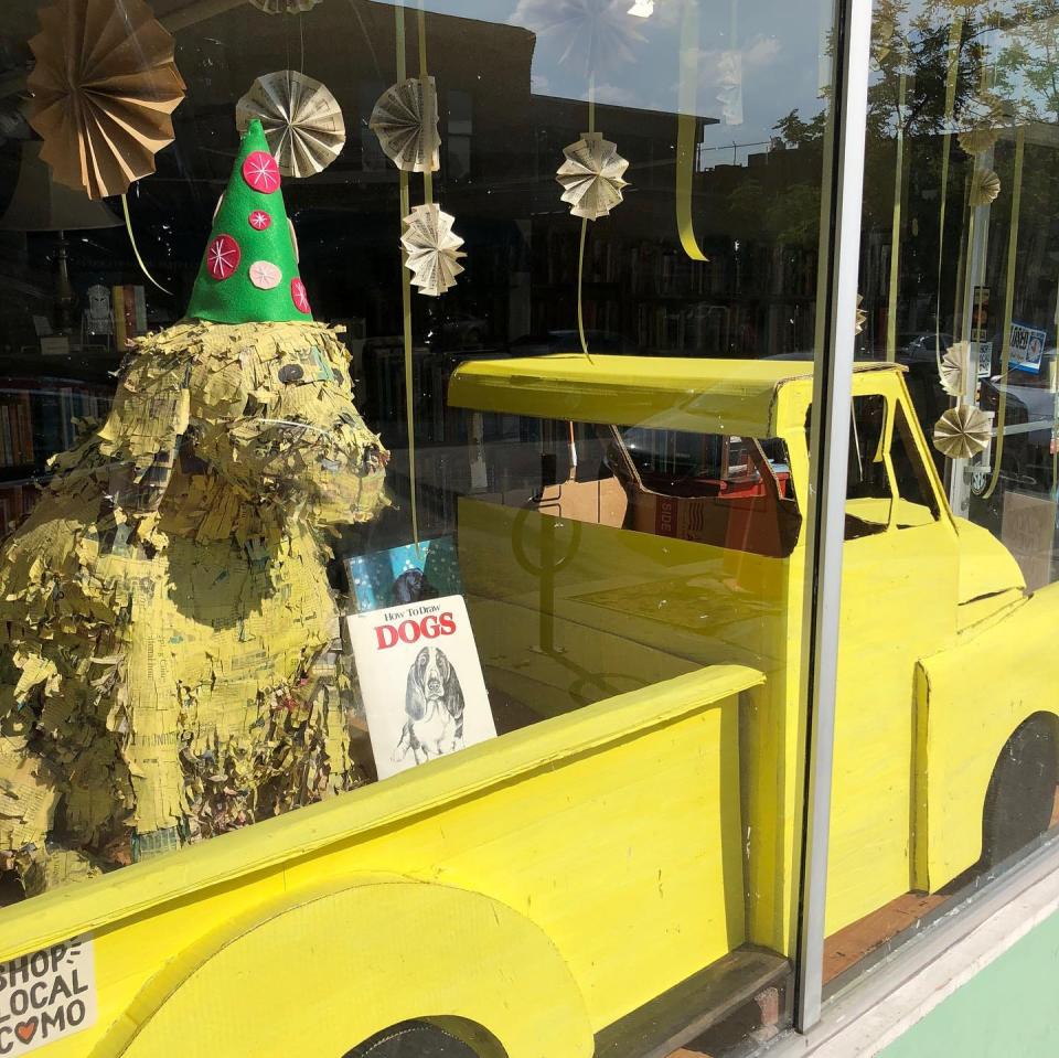 The Yellow Dog Bookshop front window celebrates a past birthday. The store turns 10 in summer 2023.