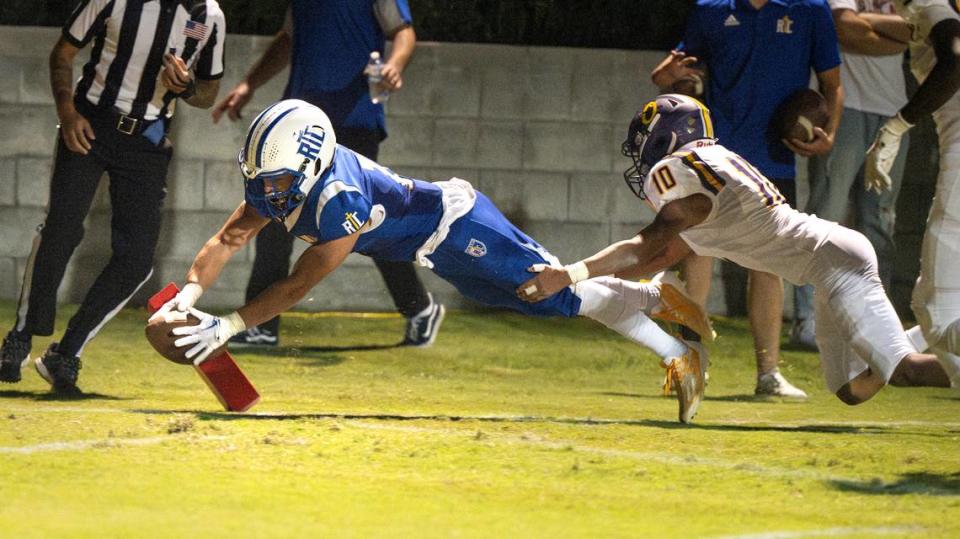 Ripon Christian’s Brady Grondz dives into an end zone during the Southern League game with Orestimba in Ripon, Calif., Friday, Sept. 22, 2023.