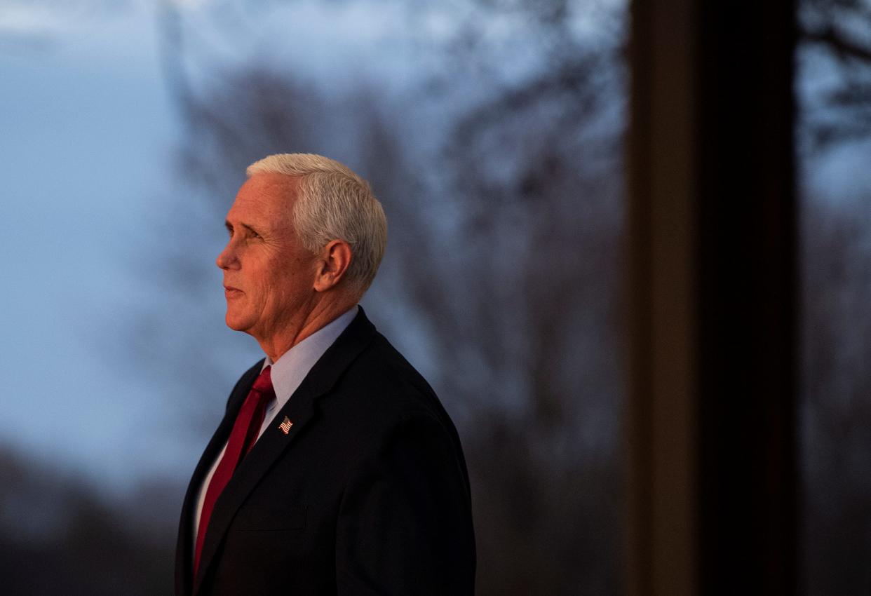 Former Vice President Mike Pence pauses to see the sunset before leaving after the annual Story County Lincoln High Way Dinner, sponsored by the Republican Party of Story County, at the Ames Golf & Country Club Saturday, April 23, 2022 in Ames.