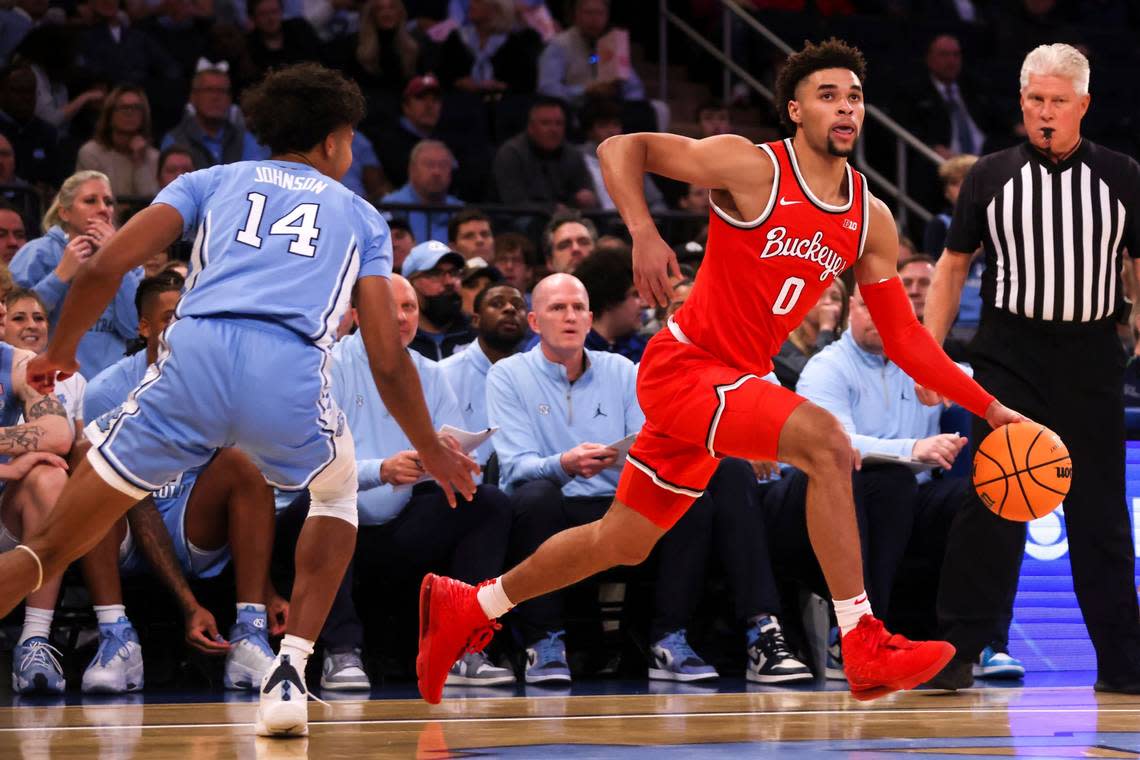 Ohio State guard Tanner Holden (0) dribbles the ball during the first half of an NCAA college basketball game against North Carolina in the CBS Sports Classic, Saturday, Dec. 17, 2022, in New York. (AP Photo/Julia Nikhinson)