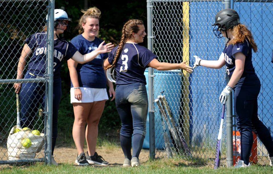 Tri-County Regional Vocational Technical High School  softball player Faith Boutin is congratulated after scoring against Old Colony, June 7, 2021.