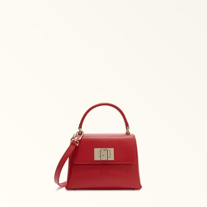 <p><a href="https://go.redirectingat.com?id=74968X1596630&url=https%3A%2F%2Fwww.furla.com%2Fus%2Fen%2Feshop%2Ffurla-1927-WB00109_ARE000_1007_03B00.html&sref=https%3A%2F%2Fwww.townandcountrymag.com%2Fstyle%2Ffashion-trends%2Fg45973127%2Fbest-top-handle-bags%2F" rel="nofollow noopener" target="_blank" data-ylk="slk:Shop Now;elm:context_link;itc:0;sec:content-canvas" class="link rapid-noclick-resp">Shop Now</a></p><p>Furla 1927</p><p>furla.com</p><p>$478.00</p>