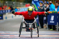 John Charles Smith of Uinted Kingdom celebrates at the finish line of the New York City Marathon after winning the 2nd place in wheelchair race in Central Park in New York, U.S., November 5, 2017. REUTERS/Brendan McDermid