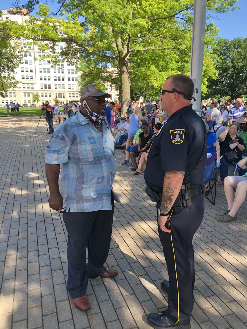 The Rev. Carl Frazier, left, pastor of New Hope and Love Community Church, visits with Topeka police Lt. Steve Roth in 2020 at the Kansas Statehouse.