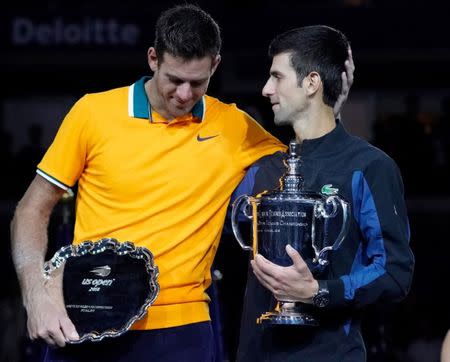 Sept 9, 2018; New York, NY, USA; Novak Djokovic of Serbia (right) and Juan Martin del Potro of Argentina stand with their trophies after the men's final on day fourteen of the 2018 U.S. Open tennis tournament at USTA Billie Jean King National Tennis Center. Mandatory Credit: Robert Deutsch-USA TODAY Sports