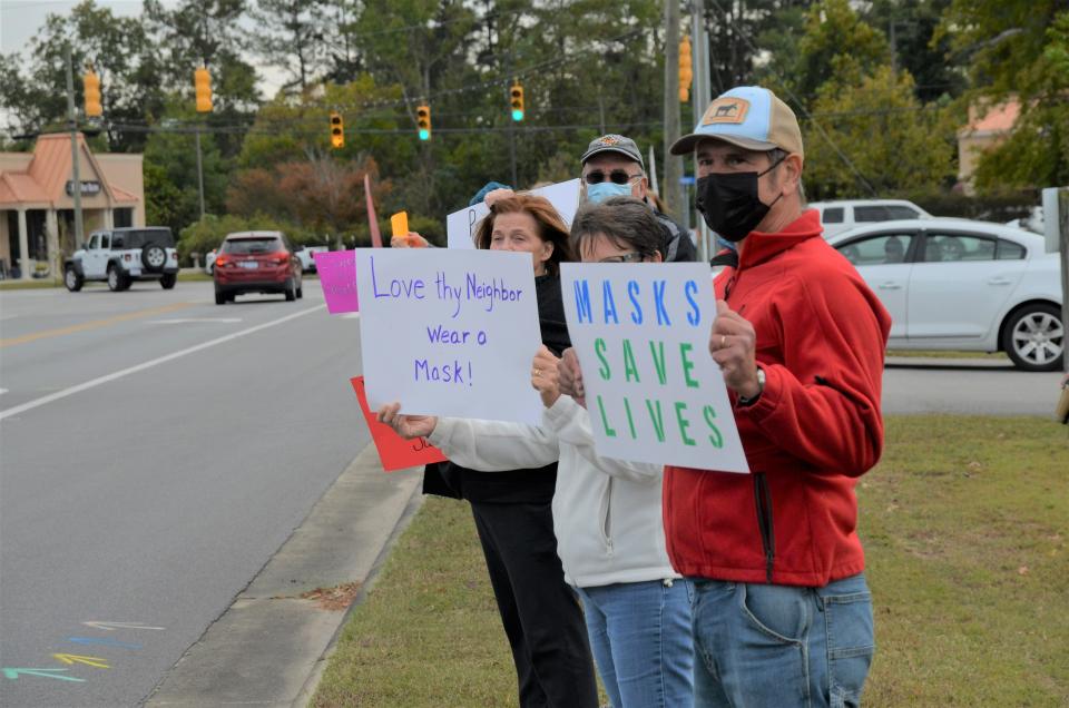 Pro mask protesters attend a rally Wednesday at the Craven School District offices.
