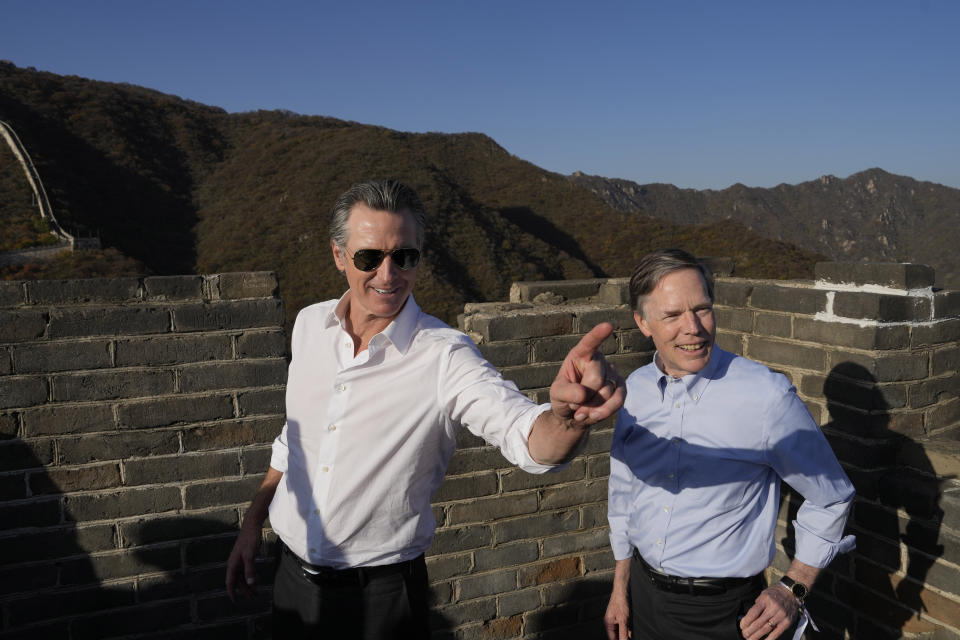 California Gov. Gavin Newsom, left, with U.S. ambassador to China Nicholas Burns during a visit to the Mutianyu Great Wall on the outskirts of Beijing, Thursday, Oct. 26, 2023. Newsom is on a weeklong tour of China where he is pushing for climate cooperation. His trip as governor, once considered routine, is drawing attention as it comes after years of heightening tensions between the U.S. and China. (AP Photo/Ng Han Guan)