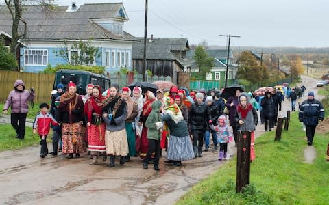 Residents of Nyonoksa take part in a folk festival last year - Credit: Sergei Yakovlev/AP
