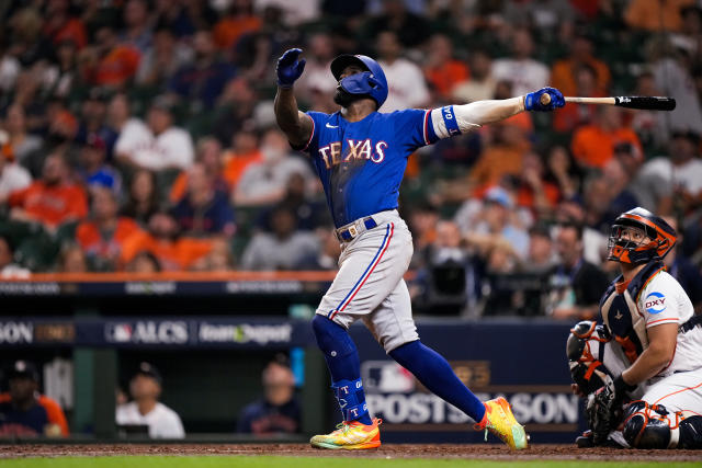 Adolis Garcia of the Texas Rangers reacts while at bat during the News  Photo - Getty Images