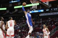 Philadelphia 76ers forward Danuel House Jr. (25) drives to the basket during the first half of an NBA basketball game against the Houston Rockets, Monday, Dec. 5, 2022, in Houston. (AP Photo/Eric Christian Smith)