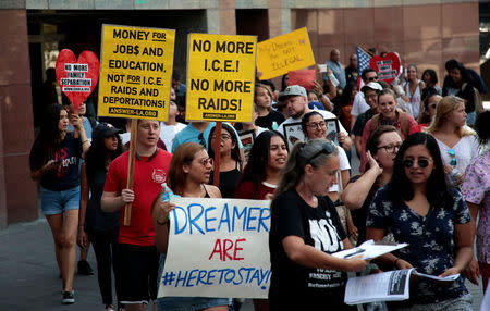 FILE PHOTO: Supporters of the Deferred Action for Childhood Arrivals (DACA) program recipient during a rally outside the Federal Building in Los Angeles, California, U.S., September 1, 2017. REUTERS/Kyle Grillot