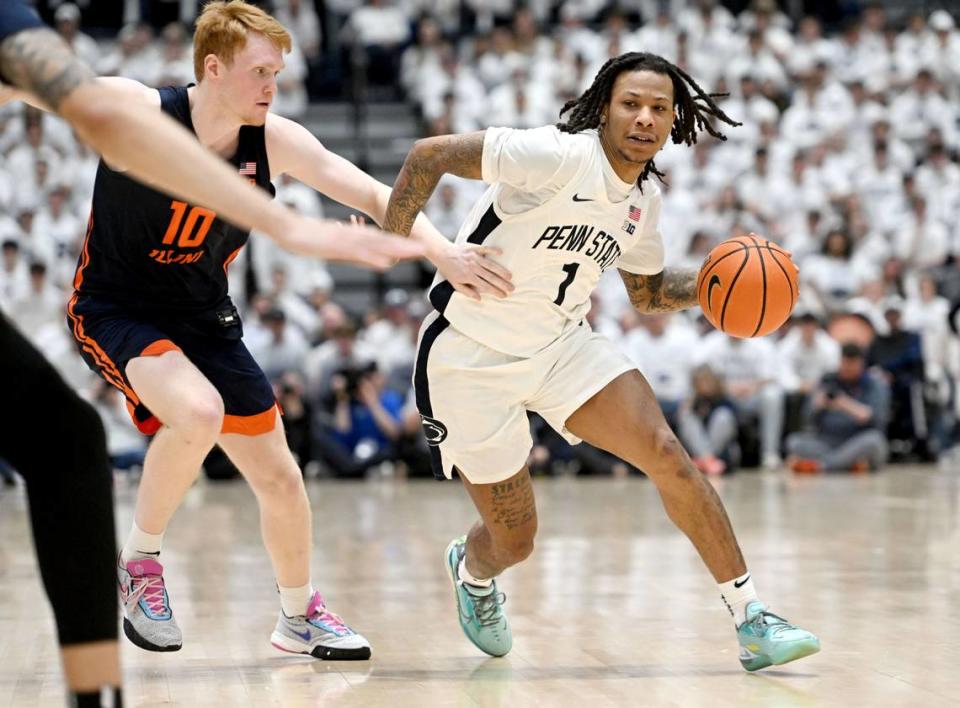 Penn State’s Ace Baldwin Jr. dribbles down the court around Illinois’ Luke Goode during the game on Wednesday, Feb. 21, 2024 at Rec Hall.