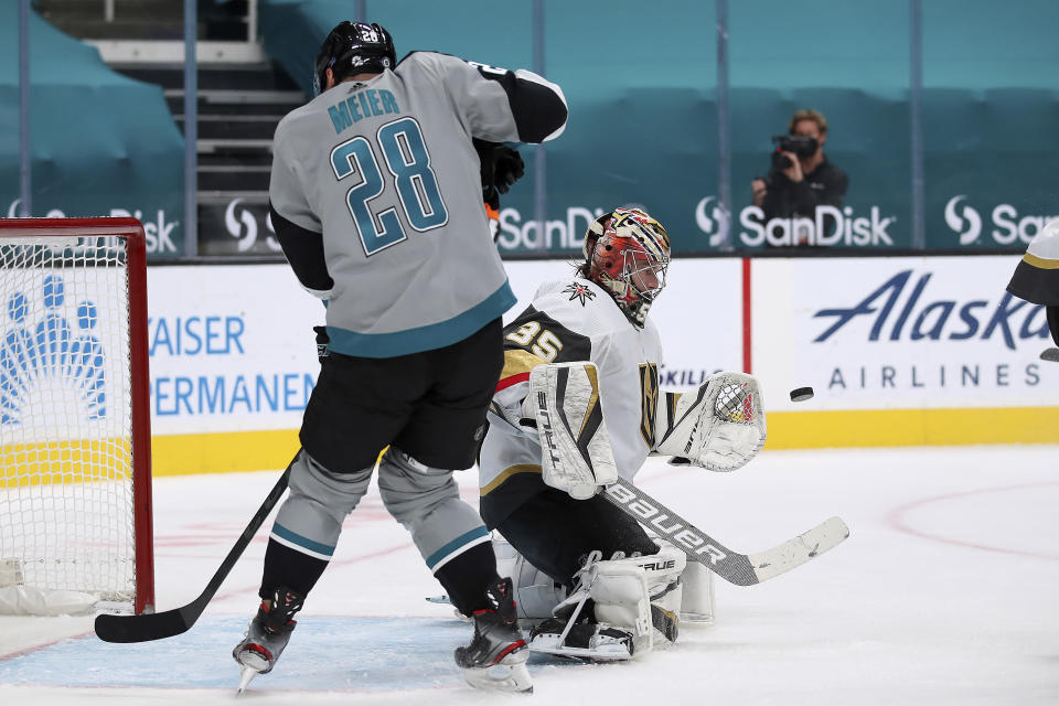 Vegas Golden Knights goaltender Oscar Dansk (35) makes a save against San Jose Sharks right wing Timo Meier (28) during the second period of an NHL hockey game in San Jose, Calif., Friday, March 5, 2021. (AP Photo/Josie Lepe)