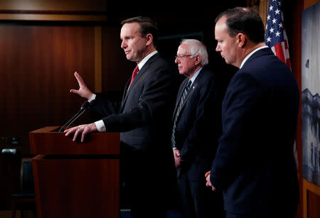 Senators Chris Murphy (D-CT), Bernie Sanders (I-VT) and Mike Lee (R-UT) speak after the senate voted on a resolution ending U.S. military support for the war in Yemen on Capitol Hill in Washington, U.S., December 13, 2018. REUTERS/Joshua Roberts