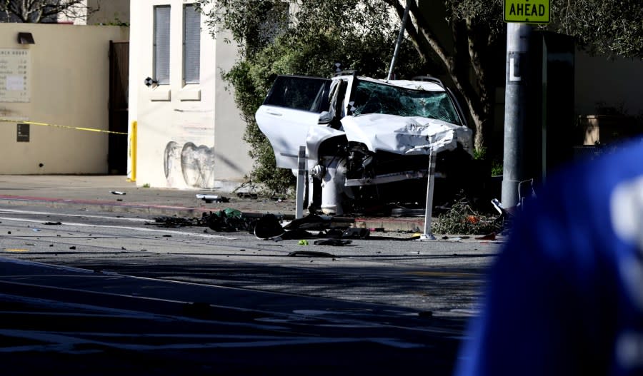 An SUV that plowed into a family waiting at a bus stop is seen at the crash scene on Saturday, March 16, 2024. (Benjamin Fanjoy/San Francisco Chronicle via AP)