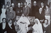 Mahatma Gandhi surrounded by well wishers at a home in London 1931. Seated to his right in a Sari, is his follower Miraben. Mohandas Gandhi (1869 Ð 1948) was the preeminent leader of the Indian independence movement in British-ruled India. (Photo by: Universal History Archive/Universal Images Group via Getty Images)