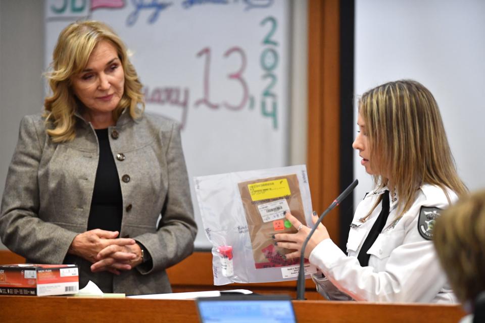 Assistant State Attorney Karen Fraivillig, left, questions witness Loren Waifer, a crime scene analyst with the Sarasota County Sheriff's Office, about a bullet recovered from the body of shooting victim Dylan Jenkins. Nyquan Priester has been charged with 2nd degree murder in connection with the shooting at Ackerman Park that killed Jenkins in December 2021.