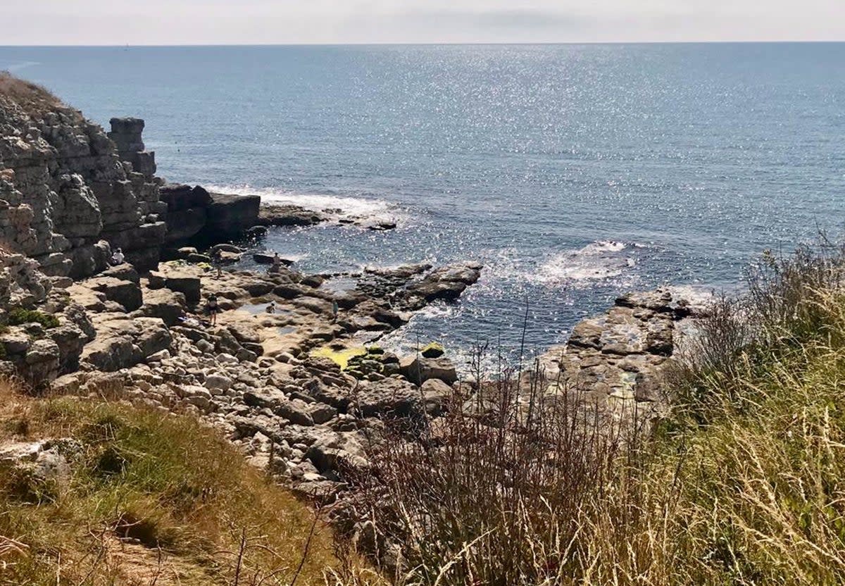 The elderly woman slipped over a sheer drop at Winspit Quarry, Dorset, on Saturday (PA)