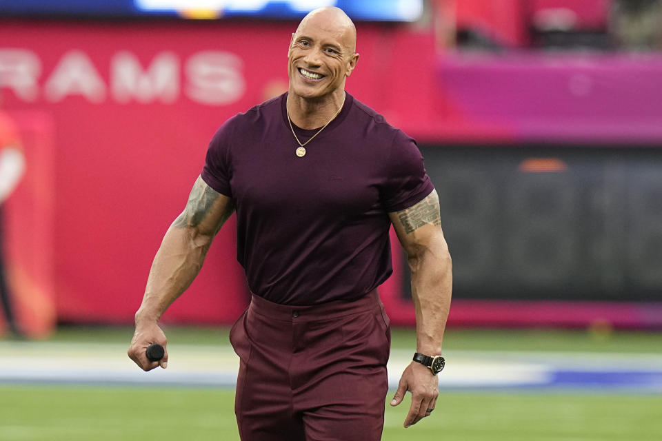 Dwayne "The Rock" Johnson smiles before the NFL Super Bowl 56 football game between the Los Angeles Rams and the Cincinnati Bengals, Sunday, Feb. 13, 2022, in Inglewood, Calif. (AP Photo/Chris O'Meara)