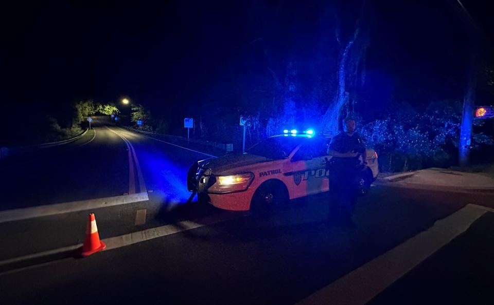 A Tallahassee Police Department officer blocks the entrance to Tom Brown Park at Easterwood Drive and Conner Boulevard around 2:30 a.m. Friday, May 26, 2023. According to TPD, a woman opened fire and "ambushed" officers in the park Thursday night. Officers returned fire, striking and killing the woman.