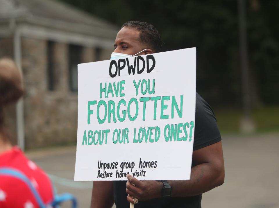 Family members rally outside the Office for People With Developmental Disabilities in Thiells, Thursday, July 9, 2020. 