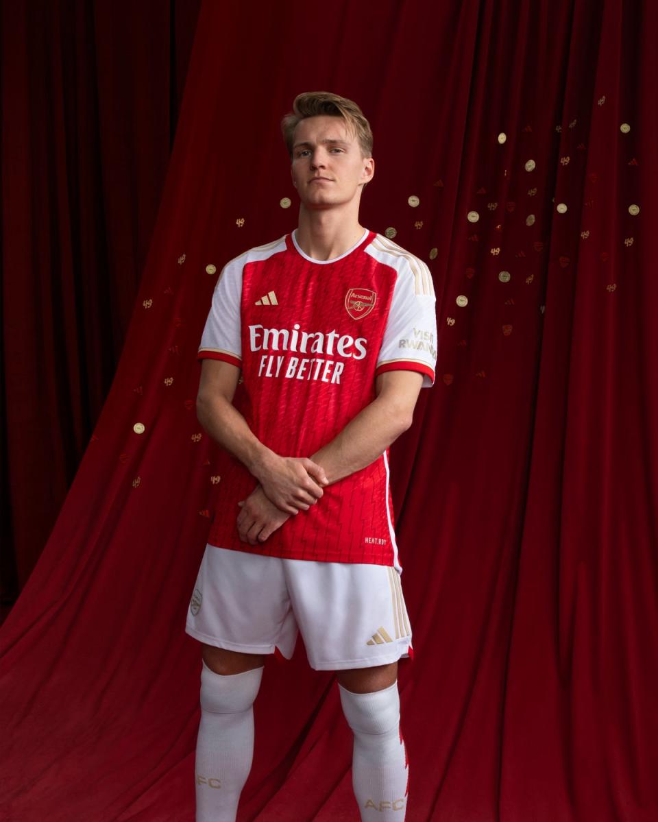 Martin Odegaard models the new kit (adidas)