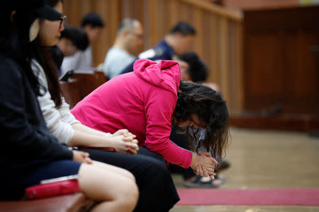 Students pray during an early-morning prayer session at the Presbyterian University and Theological Seminary (PUTS) in Seoul, South Korea, September 12, 2017. Picture taken on September 12, 2017. REUTERS/Kim Hong-Ji