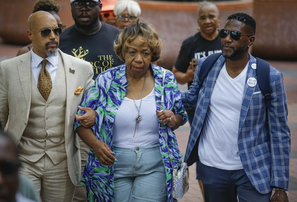 Rev. Kirsten Foy, left, president of Arc of Justice, and New York City Public Advocate Jumaane Williams, right, escort Gwen Carr, mother of chokehold victim Eric Garner, to a news conference outside New York Police Department headquarters Monday, Aug. 19, 2019, in New York. 