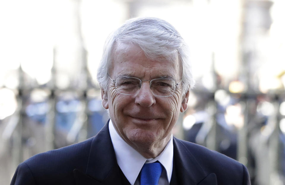 FILE - In this Thursday, Jan. 31, 2019 file photo, Britain's former Prime Minister John Major arrives to attend a service of thanksgiving for the life and work of Peter Carrington at Westminster Abbey in London. Major has threatened to take Conservative Party leadership candidate Boris Johnson to court if he tries to suspend Parliament to deliver a departure from the European Union without a deal, it was reported on Wednesday, July 10, 2019. (AP Photo/Kirsty Wigglesworth, File)