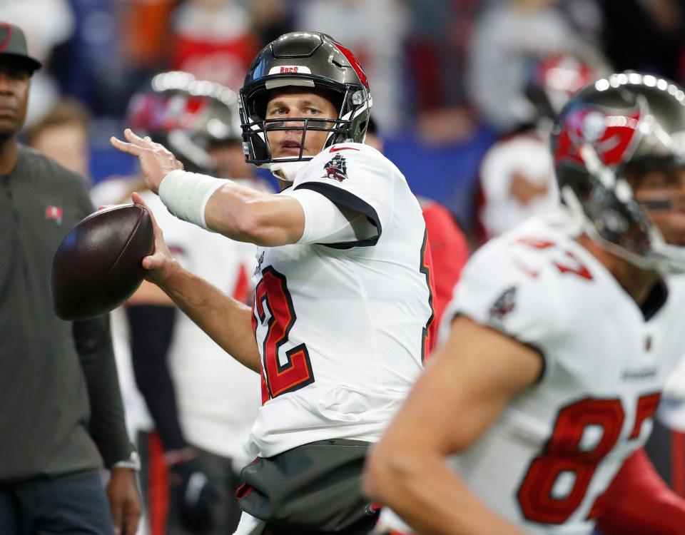 Tampa Bay Buccaneers quarterback Tom Brady (12) warms up Sunday, Nov. 28, 2021, before a game against the Tampa Bay Buccaneers at Lucas Oil Stadium in Indianapolis.