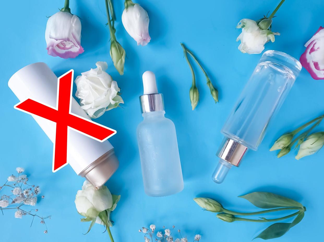 Toner is crossed out in red in a photo of skincare products arranged with flowers