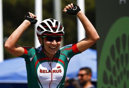 Alena Amialiusik of Belarus celebrates after winning the women's cycling road race at the 1st European Games in Baku, Azerbaijan, June 20 , 2015. REUTERS/Stoyan Nenov