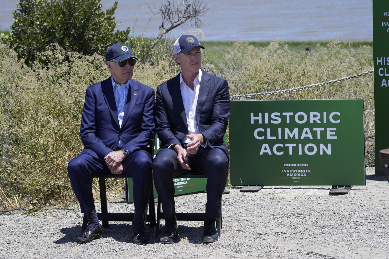 President Biden sits with California Gov. Gavin Newsom while they listen to speakers at the Lucy Evans Baylands Nature Interpretive Center and Preserve in Palo Alto, California, on Monday, June 19, 2023. (AP Photo/Susan Walsh)