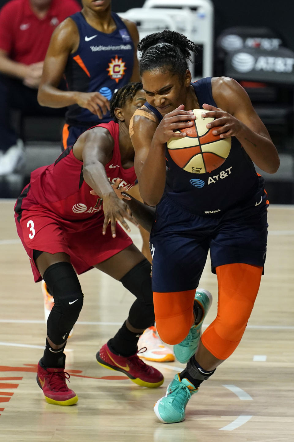 Connecticut Sun forward Alyssa Thomas (25) grabs a loose ball away from Las Vegas Aces guard Danielle Robinson (3) during the second half of Game 3 of a WNBA basketball semifinal round playoff series Thursday, Sept. 24, 2020, in Bradenton, Fla. (AP Photo/Chris O'Meara)