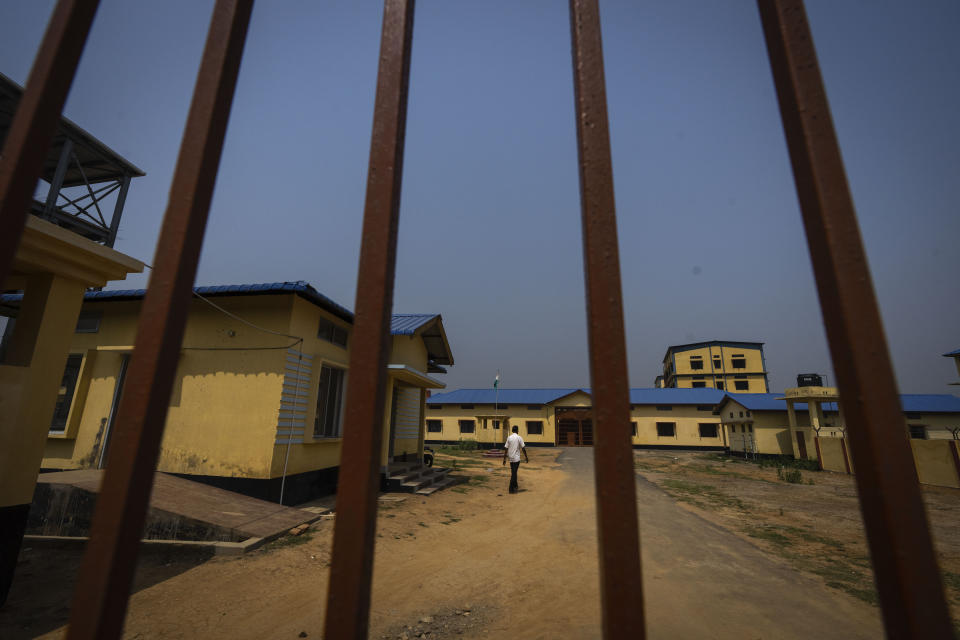 A man walks inside a detention center where suspected immigrants are held in Matiya village, northeastern Assam state, India, April 17, 2023. Nearly 2 million people, or over 5% of Assam's population, could be stripped of their citizenship unless they have documents dating back to 1971 that show their ancestors entered the country legally from neighboring Bangladesh. (AP Photo/Anupam Nath)
