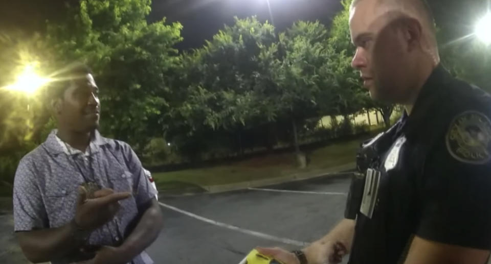 Rayshard Brooks, 27, is pictured with Atlanta police officer Garrett Rolfe in a still from body camera footage.