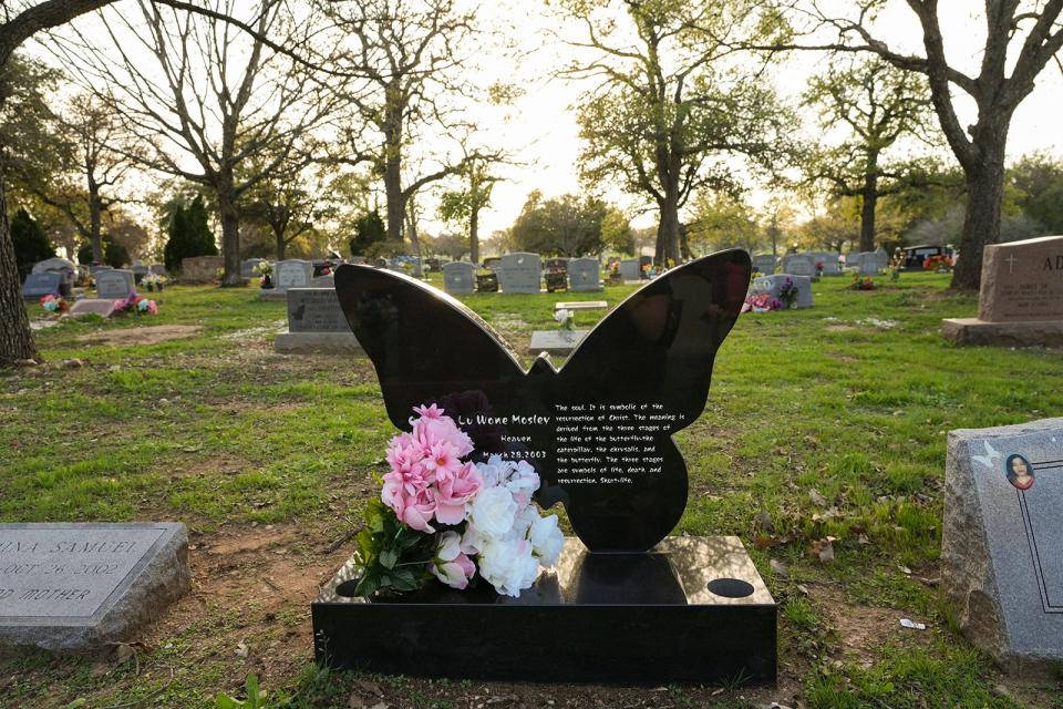 The gravesite of Ortralla Mosley is seen decorated with flowers in East Austin nearly 20 years after her death on Monday, Feb. 6, 2023.