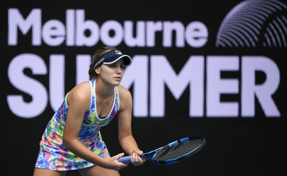 United States' Sofia Kenin waits to receive serve from Italy's Camila Giorgi during their match at a tuneup tournament ahead of the Australian Open tennis championships in Melbourne, Australia, Tuesday, Feb. 2, 2021. (AP Photo/Andrew Brownbill)