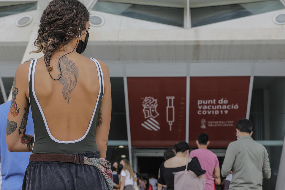 VALENCIA, VALENCIAN COMMUNITY, SPAIN - JULY 28: A woman waits to receive the vaccine against Covid-19 in the vaccination centre launched in the Ciutat de les Arts i les Ciències de Valencia, on 28 July, 2021 in Valencia, Valencian Community, Spain. This large vaccination point, one of those launched in the Valencian Community, is aimed at young people aged between 20 and 29 years. (Photo By Rober Solsona/Europa Press via Getty Images)