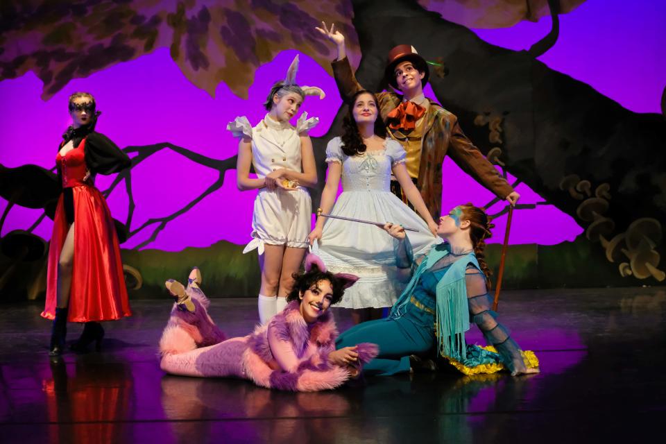 Clockwise from left: Halle Audette (as Queen of Hearts), Claire Stancy (White Rabbit), Kinsey Calderone (Alice), Roberto Silva-Neto (Mad Hatter), Caroline Bowers (Caterpillar) and Simone Gelety (Cheshire Cat) in the Otterbein Department of Theatre & Dance production of “Dance 2023: Escape to Wonderland.”