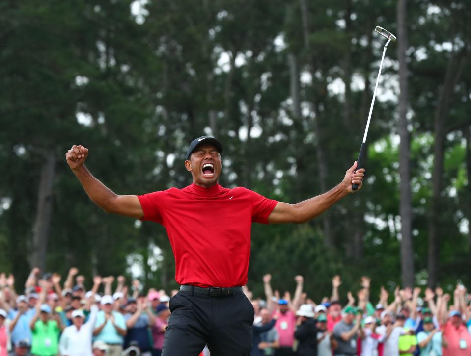FILE - Tiger Woods celebrates after making a putt on the 18th green to win The Masters golf tournament at Augusta National Golf Club on April 14, 2019. (Credit: Rob Schumacher-USA TODAY Sports)