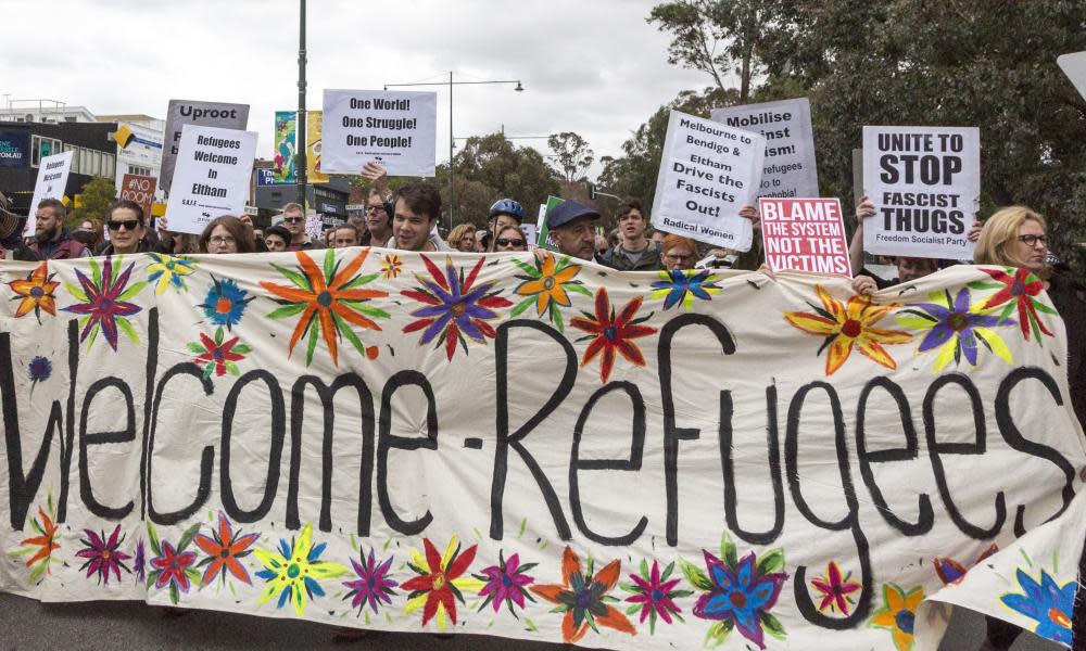 Pro-refugee protesters march in a rally in Melbourne, Australia.